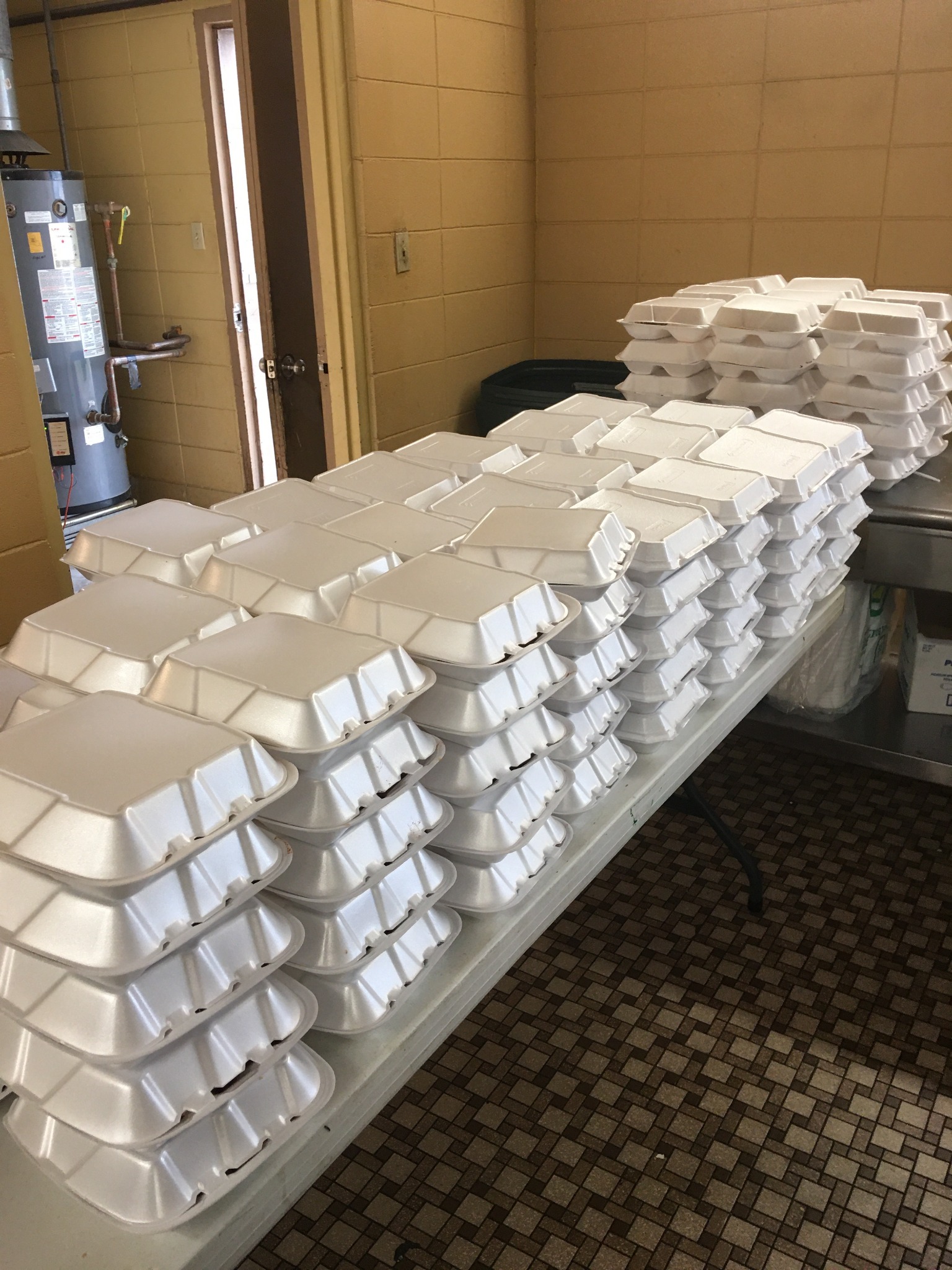 Stacks of packaged meals ready for distribution