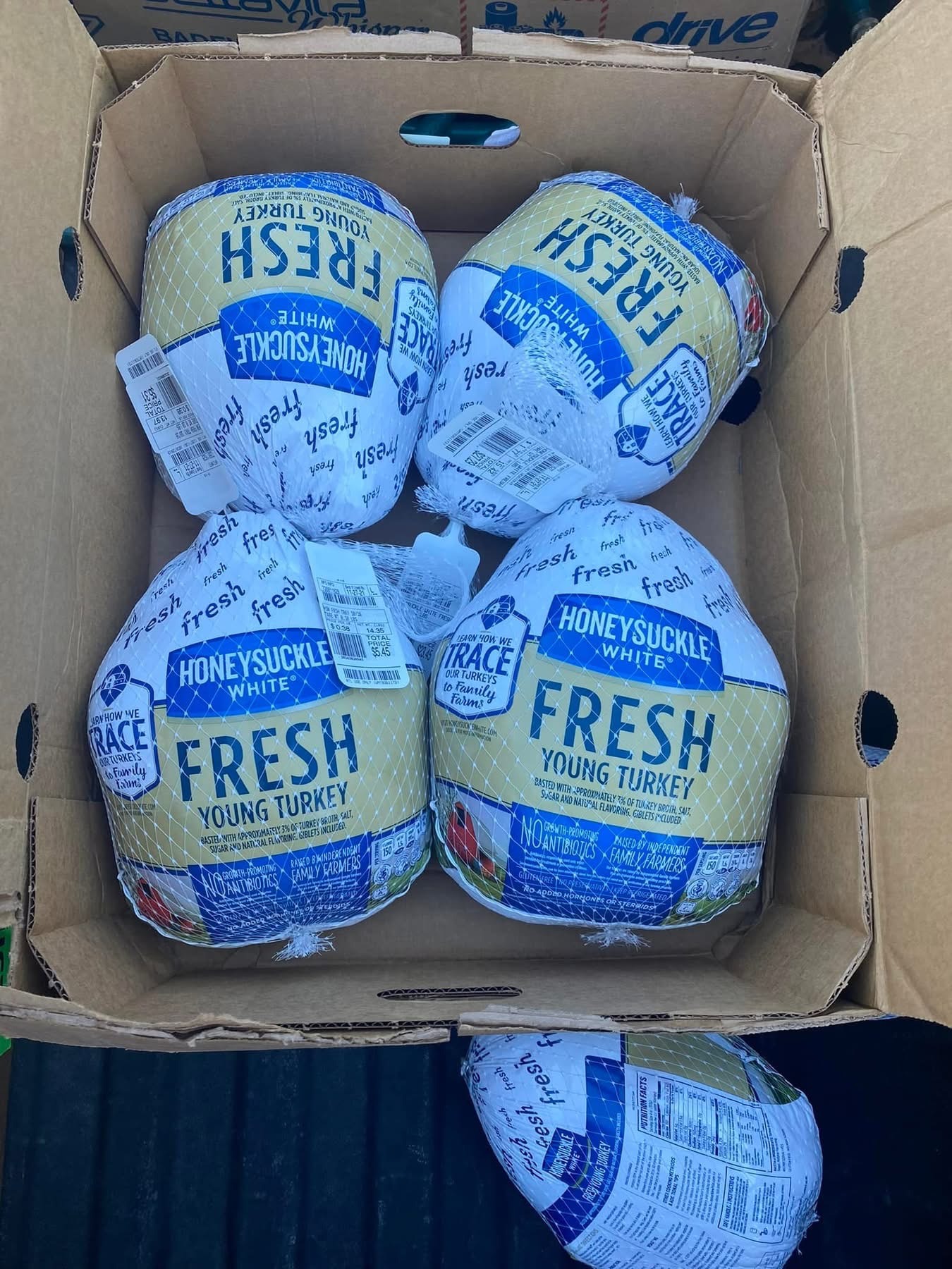 Boxes of whole turkeys for community meal distribution